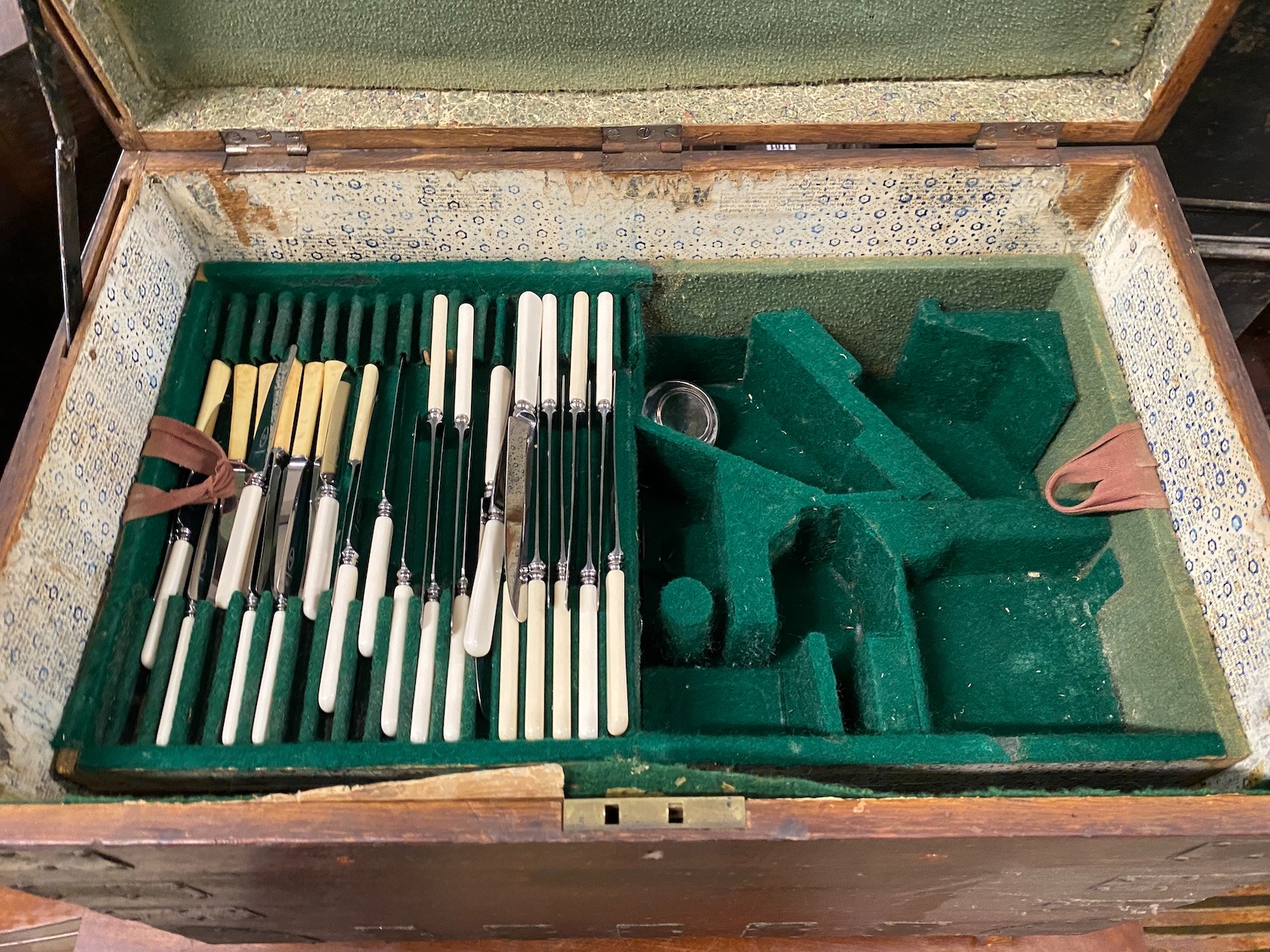 A Victorian iron bound oak silver chest with three interior trays housing assorted silver plated flatware, width 64cm, depth 41cm, height 51cm